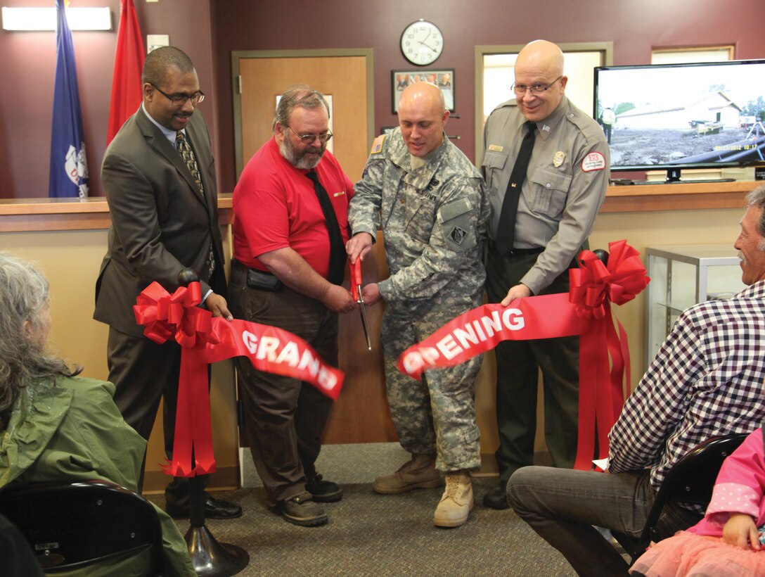 District Project Manager Simeon Francis, Maintenance Worker David Parker, Deputy Commander Maj. Rod Baker, and Natural Resources Management Supervisor Rick Beauchesne cut a ceremonial ribbon to celebrate the grand opening of Mill Creek’s new sustainable office building near Walla Walla, Wash., April 19.