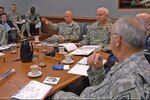 Lt. Gen. H Steven Blum, left, chief of the National Guard Bureau, and Lt. Gen. William Webster, center, deputy commander of U.S. Northern Command, discuss the 2007 military response to Hurricane Dean during USNORTHCOM's Hurricane Preparation Conference at Peterson Air Force Base, Colo., on March 14, 2008. Adjutants general from hurricane-prone states and territories participated in the third annual conference, along with representatives from the Department of Homeland Security, FEMA, Navy, Coast Guard, Army, Air Force and Canada Command. 