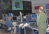 American and Canadian personnel monitor activity in the North American maritime and air domains in the new North American Aerospace Defense Command and U.S. Northern Command command center. NORAD and USNORTHCOM unveiled their new integrated command center in a May 13 ceremony at the commands’ headquarters at Peterson Air Force Base, Colo. 