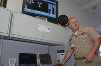 Chief Information Systems Technician Michael Layman demonstrated the Radio Interoperability System, a computer based technology which allows military and civil-band radios as well as cell-phones and even internet-based communications systems to interlink and communicate one with another during the Coalition Warrior Interoperability Demonstration 2008 at U.S. Northern Command. CWID is a technology demonstration hosted by U.S. Joint Forces Command and sponsored by the Joint Chiefs of Staff. The demonstration allows participants from industry to demonstrate technologies which can be used to assist not only USNORTHCOM personnel participating in defense support of civil authorities missions, but are useful to coalition partners and civil authorities. CWID involved multiple combatant commands and coalition partners in eight countries around the world.