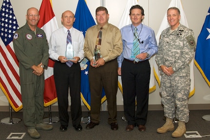 The North American Aerospace Defense Command and U.S. Northern Command 2008 2nd quarter civilian award winners are, left to right: Commander Gen. Gene Renuart, Larry Brenish, Eric Larson, Carl Johnson, NORAD and USNORTHCOM Command Senior Enlisted Leader Command Sgt. Maj. Daniel Wood. 