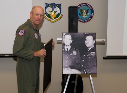 Commander of NORAD and USNORTHCOM, Gen. Gene Renuart, unveils a photo of Gen. Earl Partridge and Air Marshal Roy Sleman recently. Renuart recently approved re-naming of the Large Conference Room at NORAD and USNORTHCOM headquarters to the Partridge-Sliman Conference room in honor of the foresight and committment to international cooperation the two showed in the formative days of NORAD. Partridge was the first commander of NORAD and Sleman the first deputy.