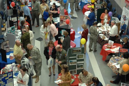 Personnel from NORAD and USNORTHCOM visit the first ever Combined Federal Campaign Rally and Charity Agency Fair Oct. 7 at the commands' headquarters. The 2008 CFC campaign "is not about money, not about goals," said NORAD and USNORTHCOM Chief of Staff, Maj. Gen. John H. Bordelon. "It's about helping people in need." Representatives from more than 20 CFC charities were present, sharing their charities with the men and women of the commands. 