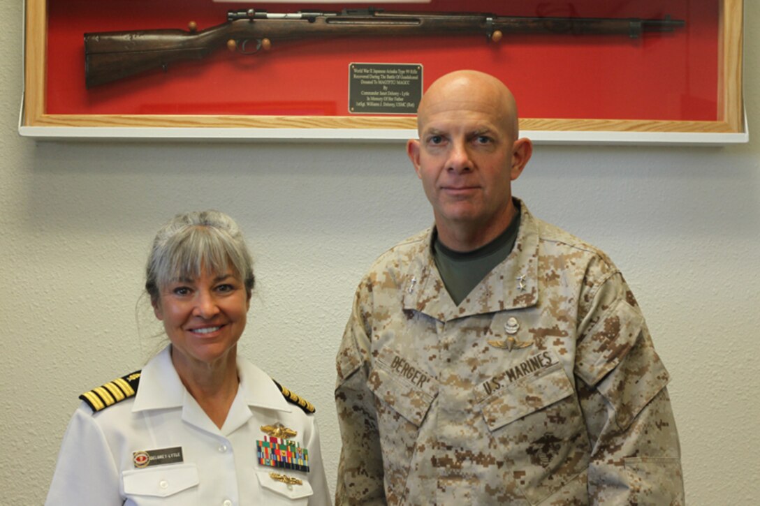 Navy Capt. Janet Delorey- Lytle, assistant clinic director, 23rd Dental Company, 1st Dental Battalion, and Maj. Gen. David H. Berger, Combat Center Commanding General, stand in front of a Japanese Arisaka Type 99 Rifle in the Commanding General’s Building May 23.