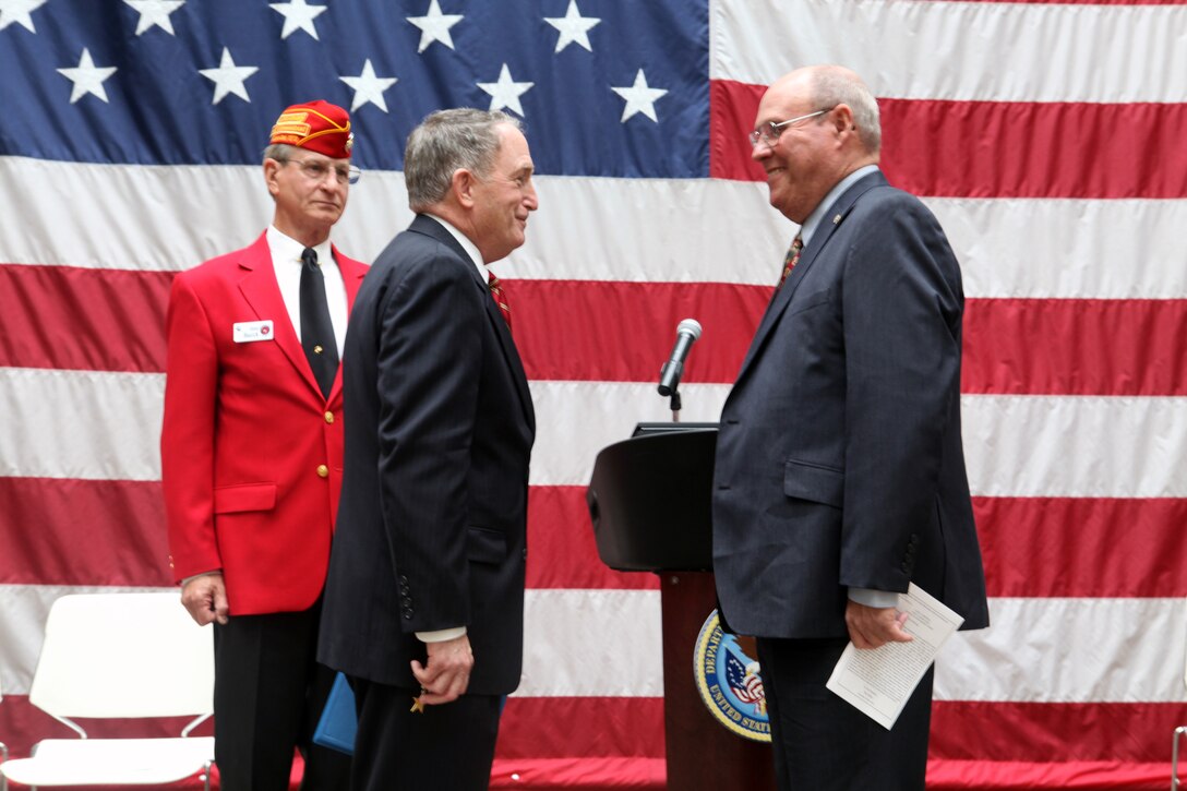 Retired Commandant of the Marine Corps, Gen. Charles C. Krulak greets Marine Sgt. Gary L. Hill before he is presented with the Silver Star Medal at the Tuscaloosa Veteran’s Affairs Medical Center here June 7, 2013. Hill received the nation’s third highest award for combat heroism for actions as a fire team leader while he deployed to Vietnam in 1967. 