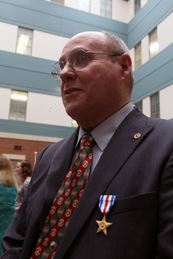 Marine Sgt. Gary L. Hill was awarded the Silver Star medal at the Tuscaloosa Veteran’s Affairs Medical Center here June 7, 2013. Hill received the nation’s third highest award for combat heroism for actions as a fire team leader while he deployed to Vietnam in 1967. Retired Commandant of the Marine Corps Gen. Charles C. Krulak presented Hill with the distinction. When his platoon commander was shot and killed, then-Lance Cpl. Hill rallied his fire team to locate and kill an enemy.  He then single-handedly bounded to an enemy trench line and killed three North Vietnamese Army soldiers. Hill then ordered his fire team to provide suppressive fires as he maneuvered to locate an NVA sniper. Once the sniper was exposed, Hill and his team killed the sniper and evacuated wounded comrades to safety. His actions saved the lives of eight Marines. 