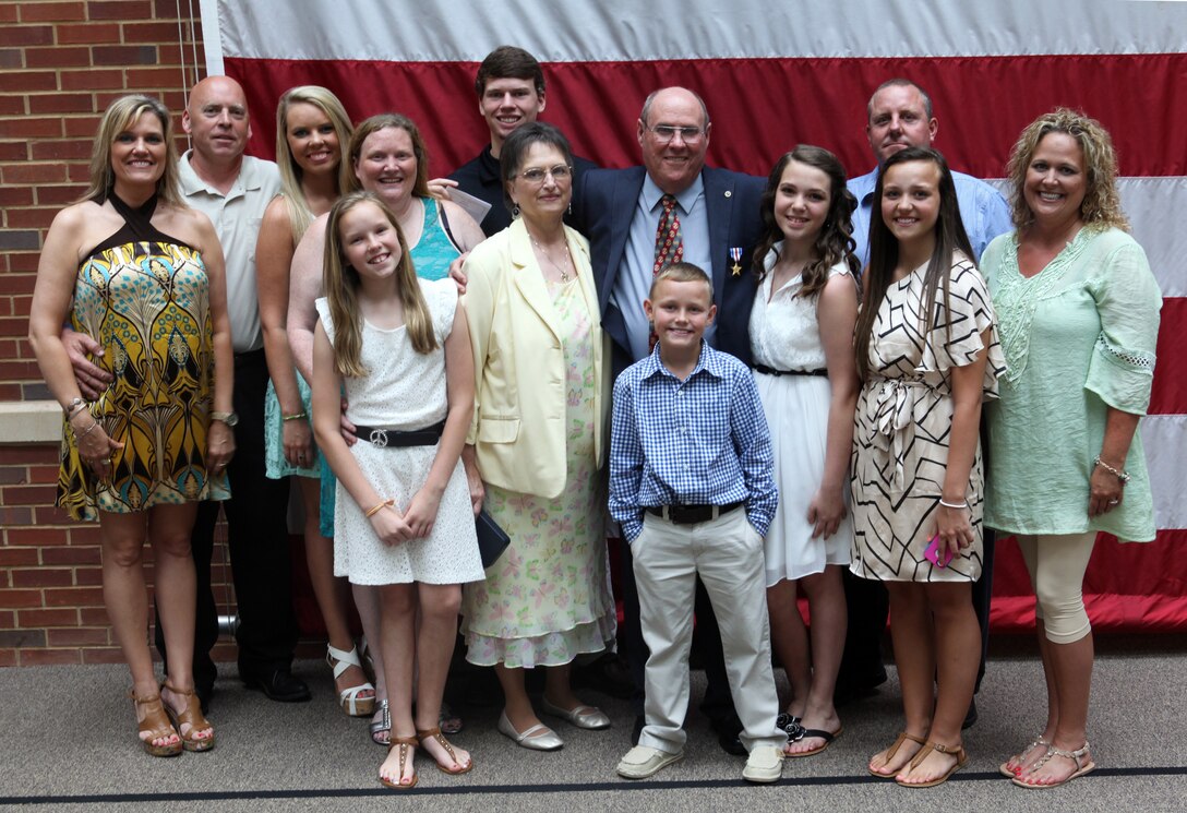 Marine Sgt. Gary L. Hill gathers with his immediate and extended family who came to show their support for his military service after his Silver Star Medal ceremony at the Tuscaloosa Veteran’s Affairs Medical Center here June 7, 2013. Retired Commandant of the Marine Corps Gen. Charles C. Krulak presented Hill with the nation’s third highest award for his heroic actions while deployed to Vietnam in 1967