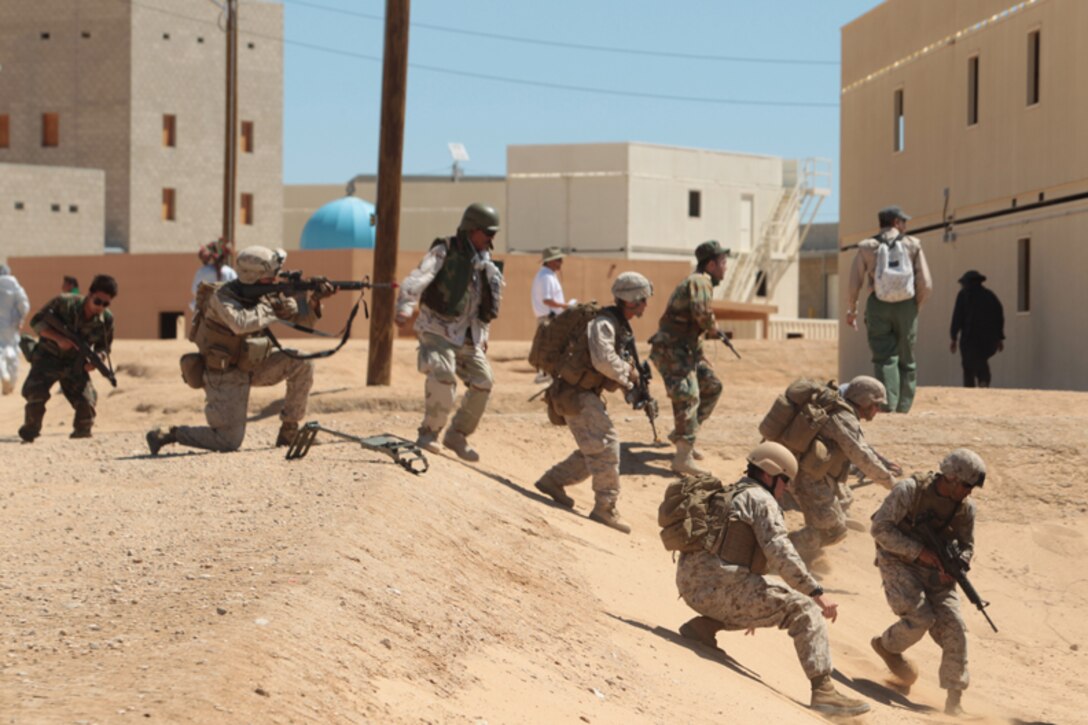Marines with Company K and Company L, 3rd Battalion, 7th Marine Regiment, conduct counterinsurgency exercise at the Combat Center’s Range 220 Monday. The Marines utilized 2/7 personnel to evaluate their training during the Mission Rehearsal Exercise
