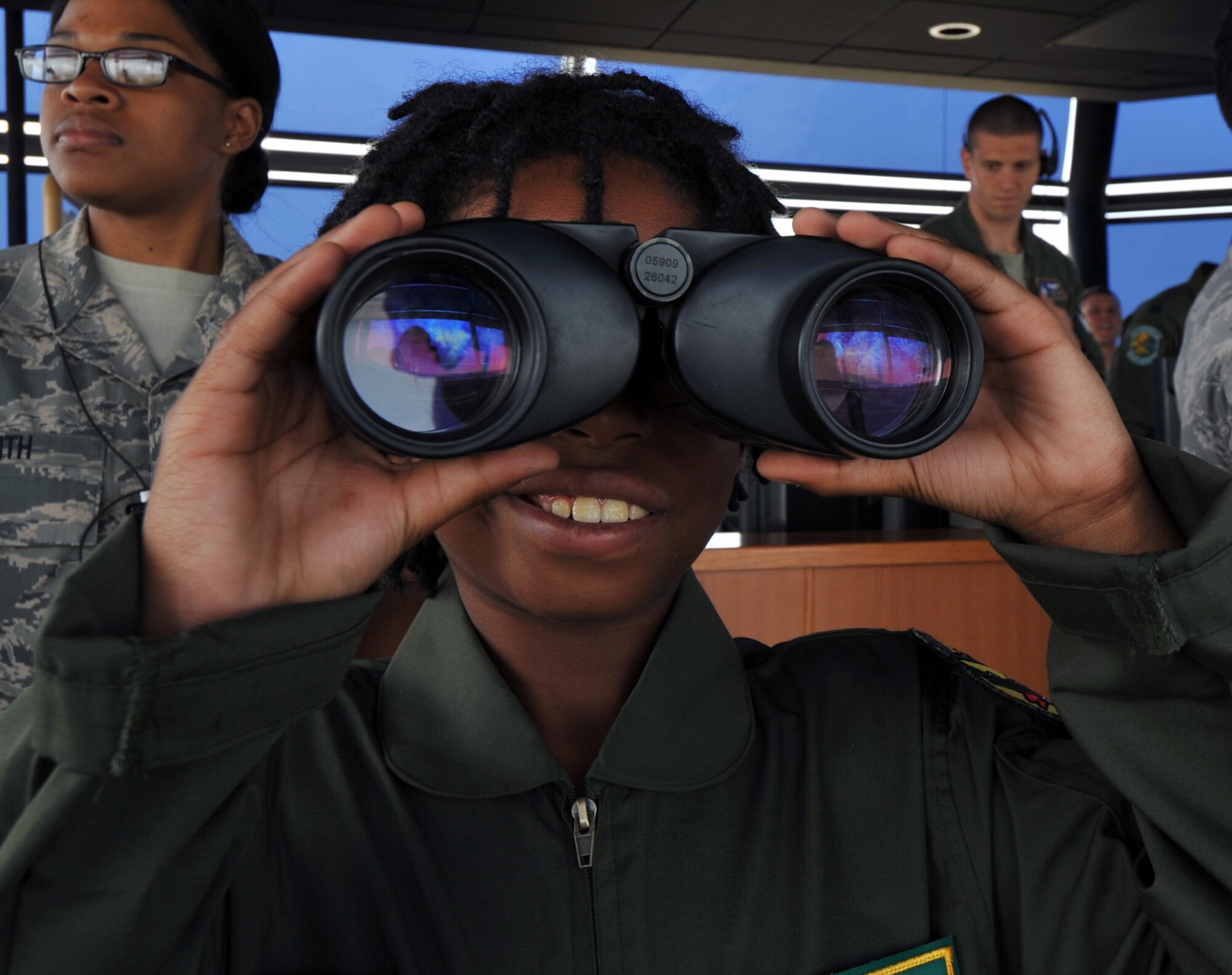 Noah Catman, 10-year-old Osan American Elementary School student, looks out on the flightline from the air traffic control tower during a Pilot for a Day tour at Osan Air Base, Republic of Korea, June 6, 2013. Through the Pilot for a Day Program, elementary school students here are given the chance to experience a day in the life of an Osan fighter pilot through tours of the squadrons and agencies such as the fire department and air traffic control. (U.S. Air Force photo/Senior Airman Alexis Siekert)