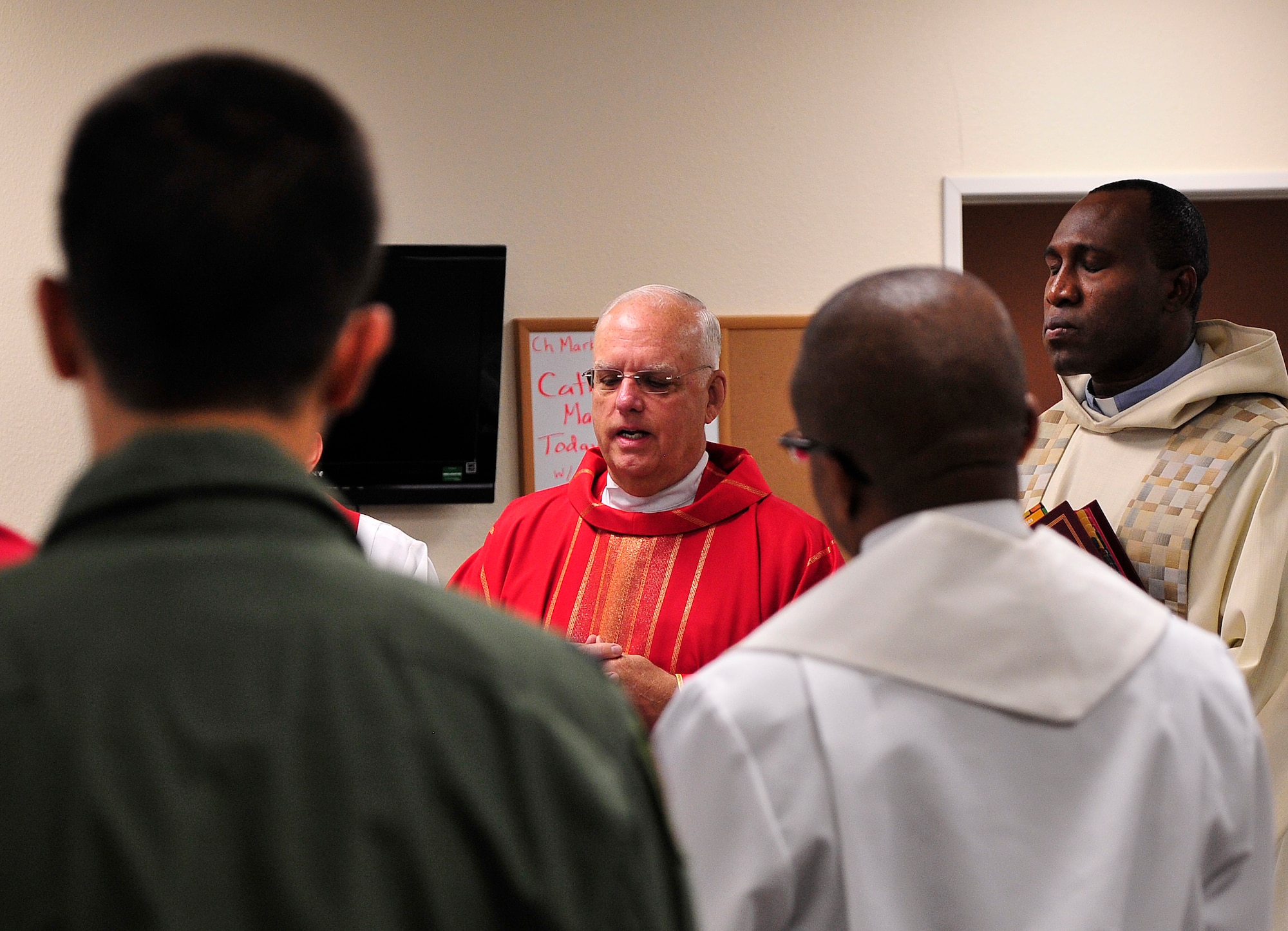 LAS VEGAS, Nev. -- Father John Kinney and Father Joseph Idomele celebrate Mass as part of the U.S. Air Force’s “Come Be With Us” chaplain recruiting tour June 11, 2013.  The tour brings active duty chaplains and civilian priests to Nellis and Creech Air Force Base to help recruit new chaplains. (U.S. Air Force photo by Staff Sgt. D.H./Released)