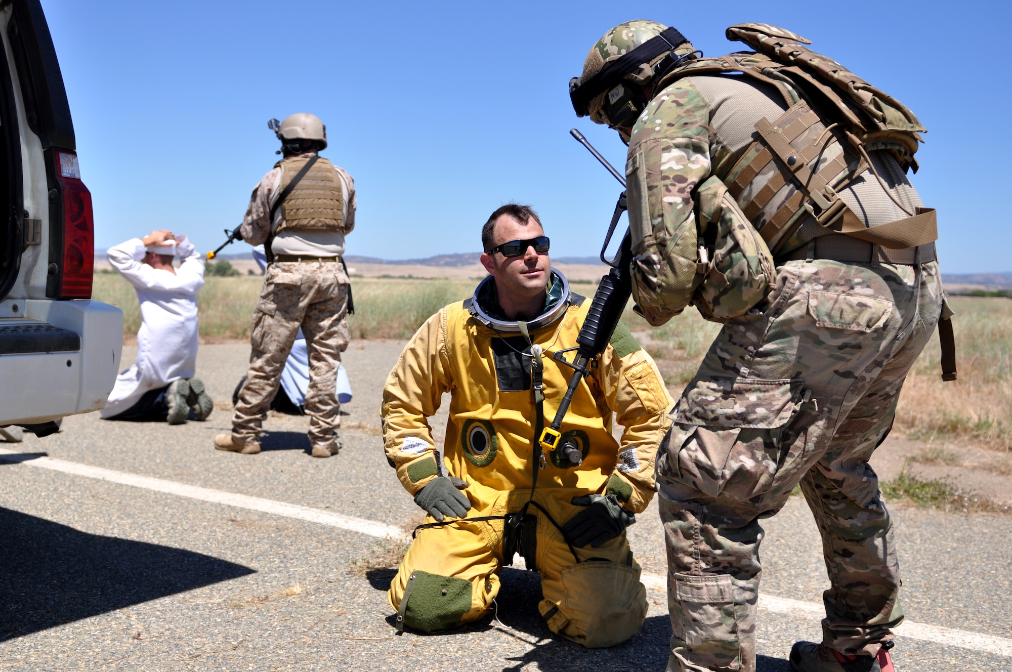 A special operator authenticates the status of a simulated downed U-2 pilot during a combat search and rescue exercise at Beale Air Force Base, Calif., May 31, 2013.  (U.S. Air Force photo by Robert Scott/Released)