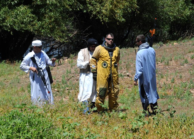 Simulated opposition forces capture a downed U-2 pilot during a combat search and rescue exercise at Beale Air Force Base, Calif., May 31, 2013. Many base agencies participated in the exercise, as well as the 129th Rescue Wing stationed at Moffett Federal Airfield, Calif.  (U.S. Air Force photo by Sean Bhakta/Released)