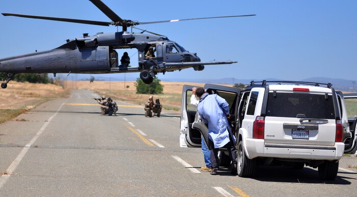 Members from the 129th Rescue Squadron and special operations forces perform vehicle interdiction during a combat search and rescue exercise at Beale Air Force Base, Calif., May 31, 2013. The squadron utilizes the HH-60G Pave Hawk for its CSAR missions. (U.S. Air Force photo by Robert Scott/Released)