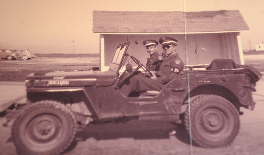 Dock Harris (right), a 32-year volunteer at the base pharmacy, is pictured in his Army Air Corps military police uniform in 1949. (courtesy photo)