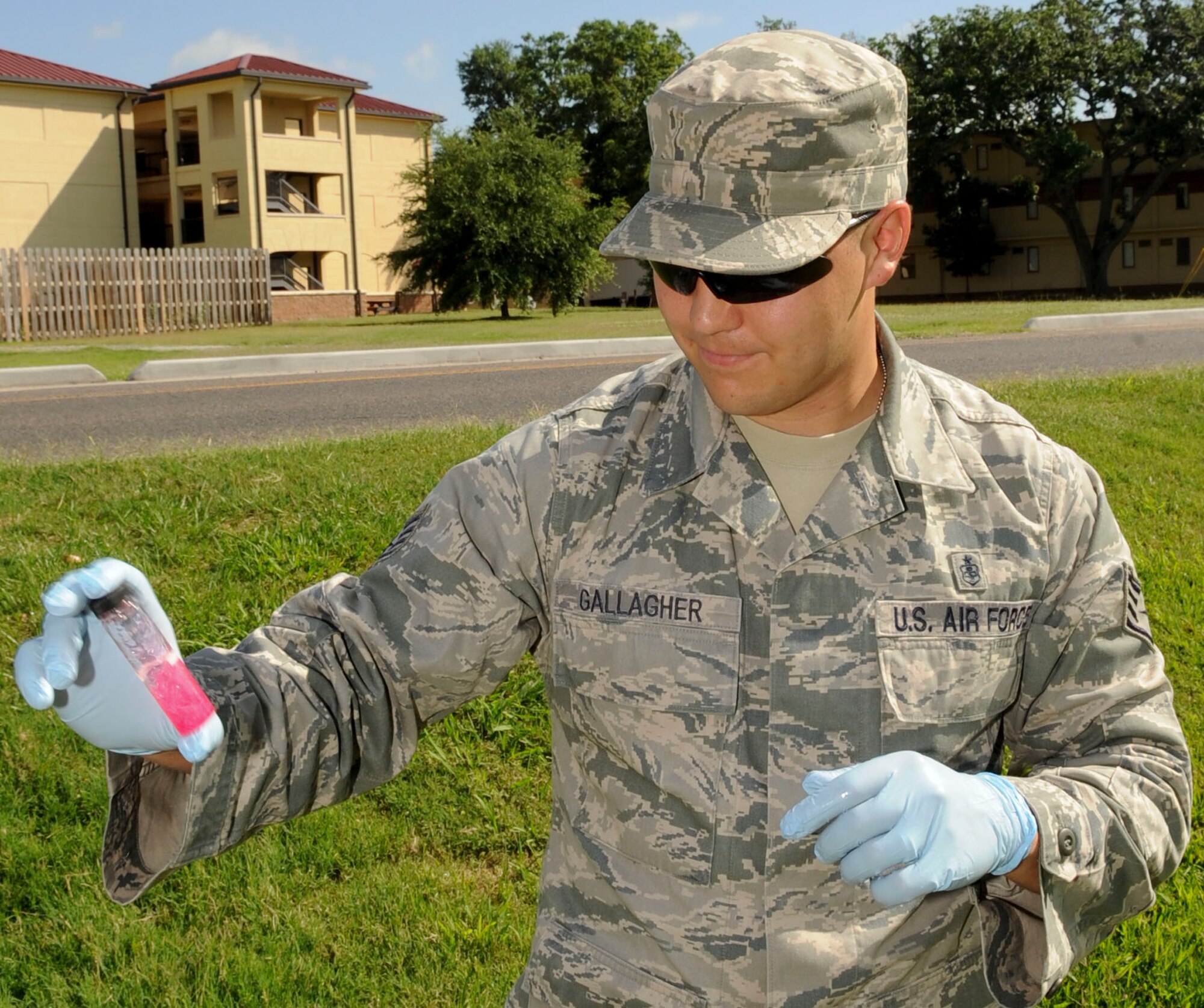 Staff Sgt. Shawn Gallagher, 2nd Aerospace Medical Squadron bioenvironmental engineer, mixes a water sample with a reagent to check chlorine residuals in the water on Barksdale Air Force Base, La., June 11, 2013. The sample will be dropped off at a state laboratory and tested for bacteriological contamination to ensure compliance with Louisiana's standards for Barksdale's drinking water system. (U.S. Air Force photo/Senior Airman Kristin High)

