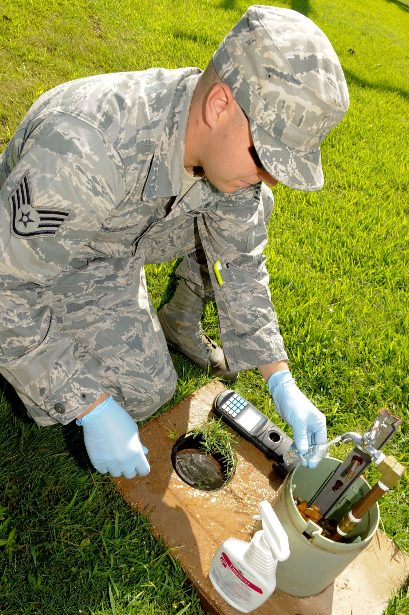 Staff Sgt. Shawn Gallagher, 2nd Aerospace Medical Squadron bioenvironmental engineer, fills a test tube with a water sample on Barksdale Air Force Base, La., June 11, 2013. The sample will be dropped off at a state laboratory and tested for bacteriological contamination to ensure compliance with Louisiana's standards for Barksdale's drinking water system. (U.S. Air Force photo/Senior Airman Kristin High)

