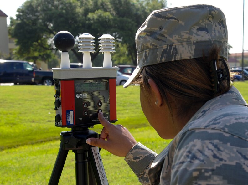 Airman 1st Class Jasmine Simon, 2nd Aerospace Medical Squadron bioenvironmental engineer, conducts a wet-bulb test on Barksdale Air Force Base, La., June 11, 2013. Wet-bulb tests are used to establish the heat-stress index, which helps determine safe work/rest cycles. (U.S. Air Force photo/Senior Airman Kristin High) 