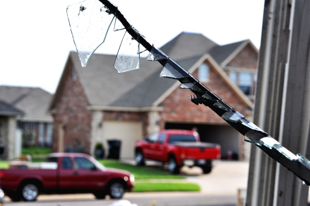 Through a destroyed window is the image a home untouched by the EF-5 (Enhanced Fujita Scale) tornado that ripped through Moore, Okla. May 20. The tornado was 1.3 miles wide with winds speeds estimated at 210 mph. (U.S. Air Force photo/Kimberly Goff /Released)