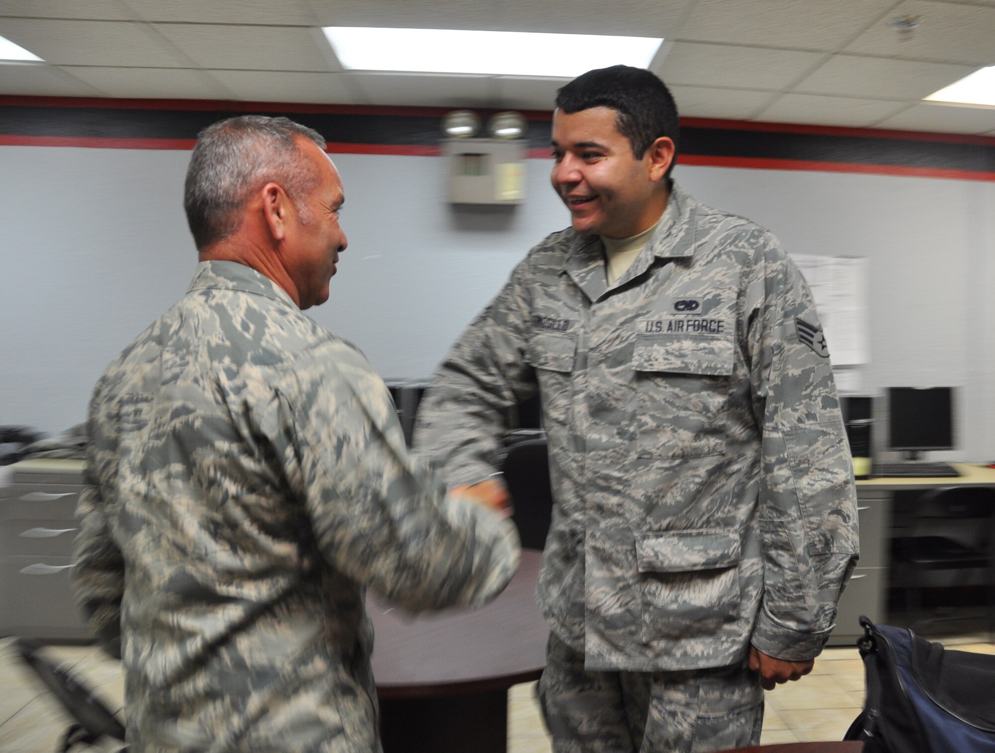 Col Kurt Gallegos, 944th Fighter Wing commander, coined Senior Airman Anselmo Hermosillo, 924th Maintenance Squadron crew chief, during his recent visit to Davis Monthan Air Force Base, Ariz. (U.S. Air Force photo/Maj. Elizabeth Magnusson)
