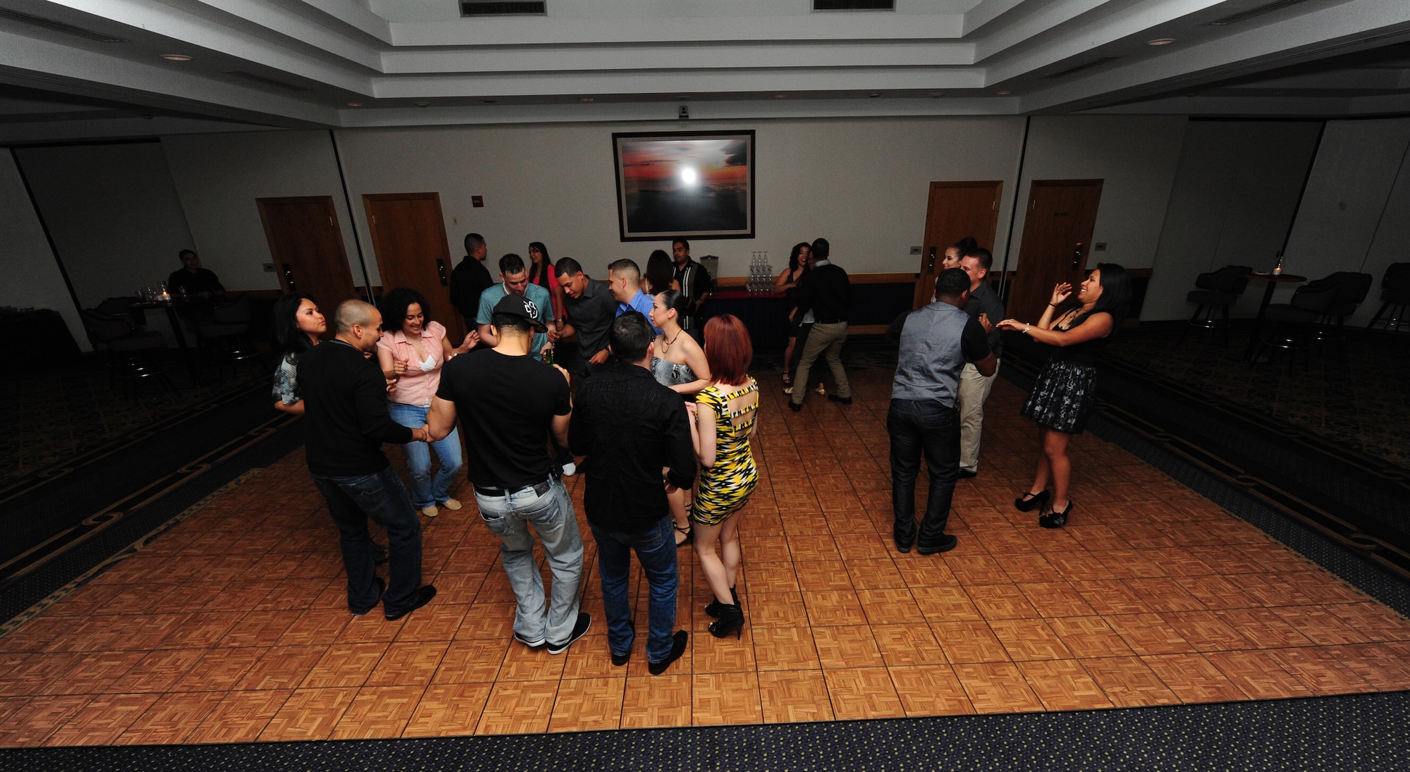Airmen and spouses party on the dance floor during Latin Night at Whiteman Air Force Base, Mo., June 1, 2013. The volunteers who put on the event plan to host a Latin Night at Mission’s End once a month. (U.S. Air Force photo by Staff Sgt. Nick Wilson/Released) 