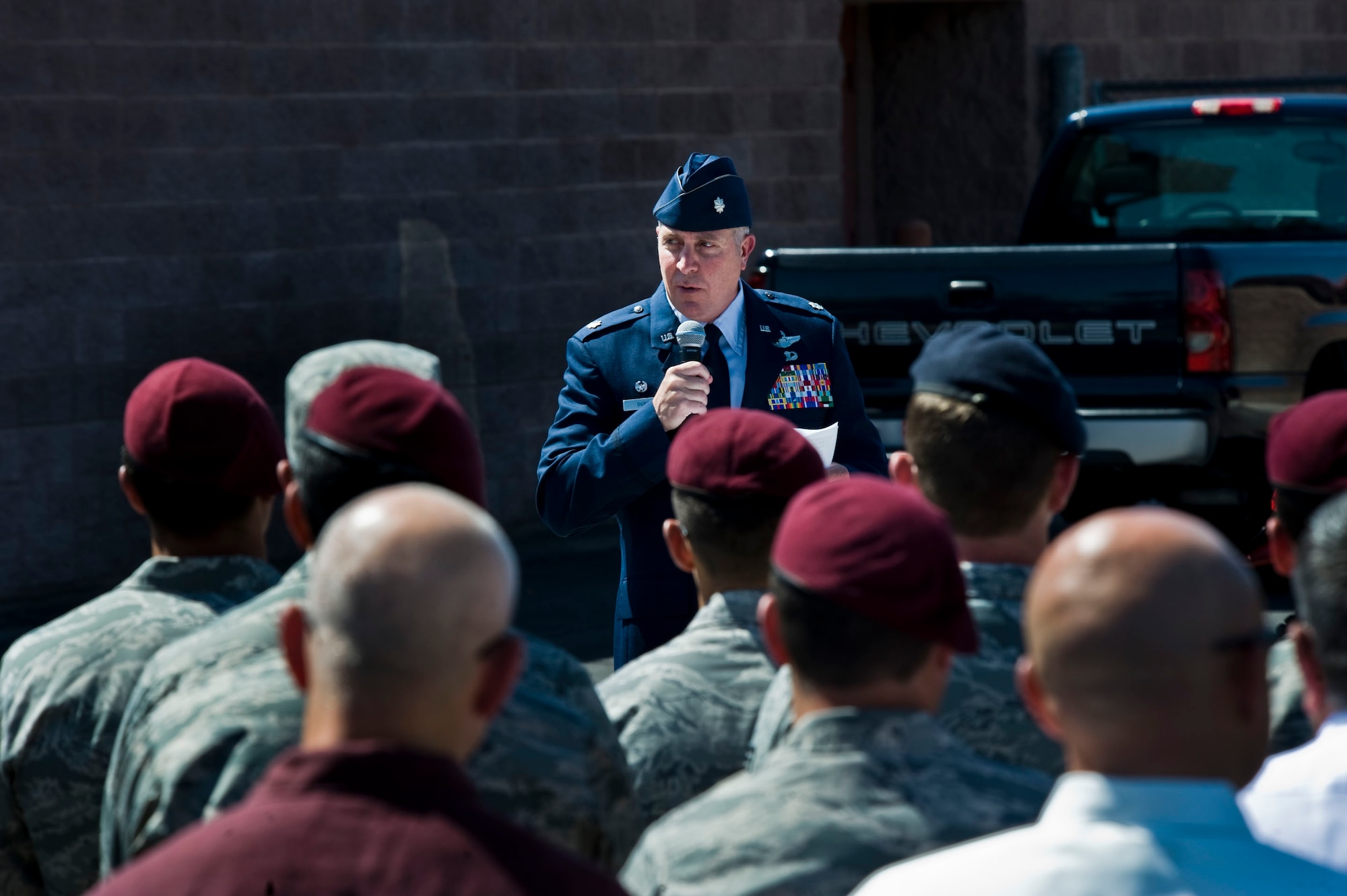 Lt. Col. Daniel Duffy, 66th Rescue Squadron commander, speaks to Airmen during a street renaming ceremony June 10, 2013, at Nellis Air Force Base, Nev.  The PEDRO 66 crew's HH-60G Pavehawk helicopter was shot down and crashed in southwest Afghanistan June 9, 2010, killing five of the crew and critically injuring two. (U.S. Air Force Photo by Airman 1st Class Jason Couillard)