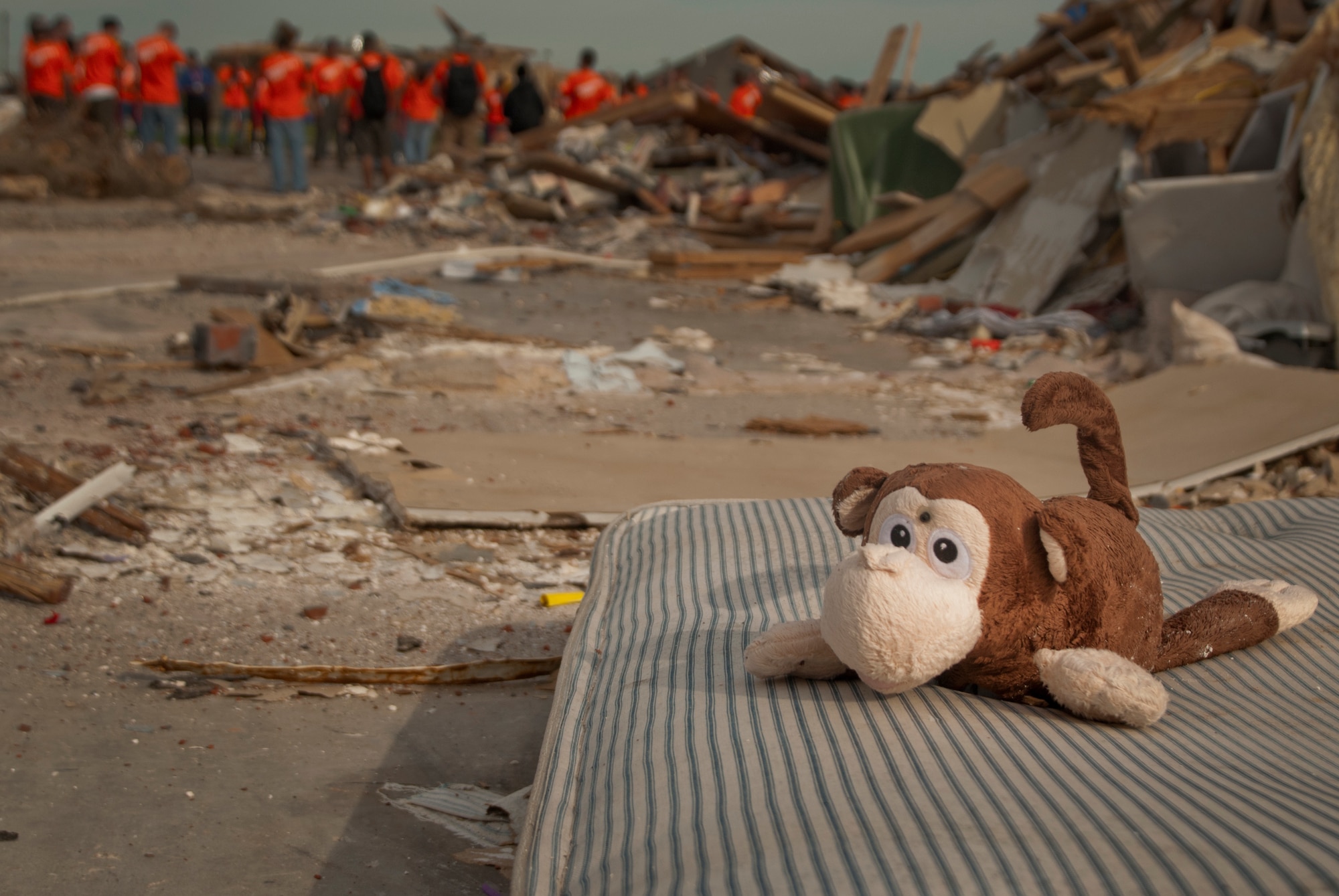 Remnants of lives torn apart by a powerful tornado litter the ground in Moore, Okla., June 8.  Airmen from Sheppard Air Force Base, Texas, gather to clean up debris during a chapel sponsored trip. The twister spanned more than 1.25 miles in width at the greatest point. (U.S. Air Force photo/Staff Sgt. Mike Meares/Released)