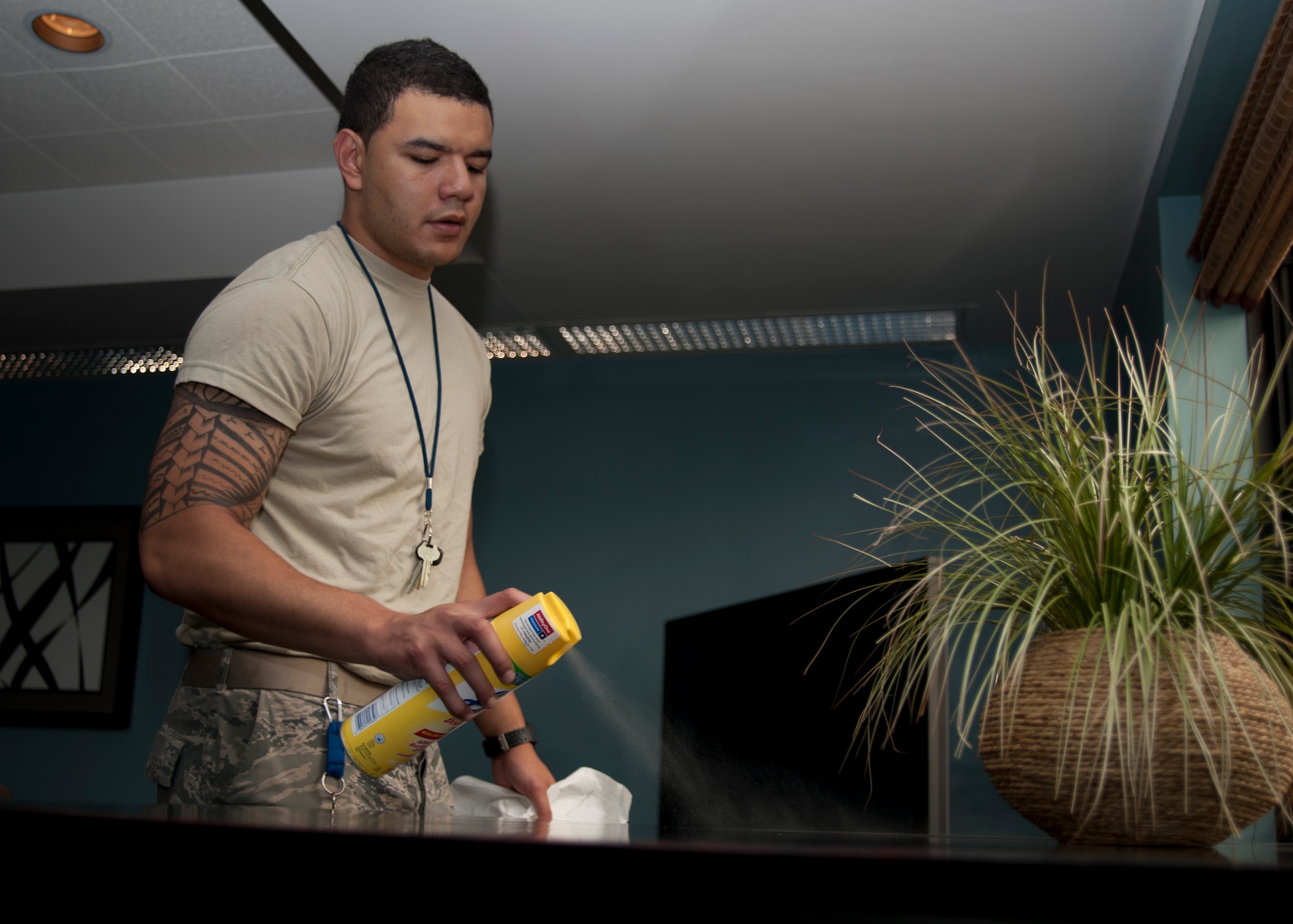 Airman 1st Class Patrick Hennings, 22nd Medical Operations Squadron medical technician cleans day room table in Building 350, June 5, 2013, McConnell Air Force Base, Kan. Bay orderlies have the flexibility to complete tasks at their own pace. (U.S. Air Force Photo/Airman John Linzmeier)