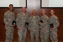 The Ageless Wonders team from the 28th Medical Group receives awards from Col. Thomas Goulter Jr., 28th Mission Support Group commander, after winning the Warrior Challenge at Ellsworth Air Force Base, S.D., June 5, 2013. The Ageless Wonders completed the course in 42 minutes and 10 seconds, the fastest time of the 12 teams that competed. (U.S. Air Force photo by Airman 1st Class Alystria Maurer/Released)