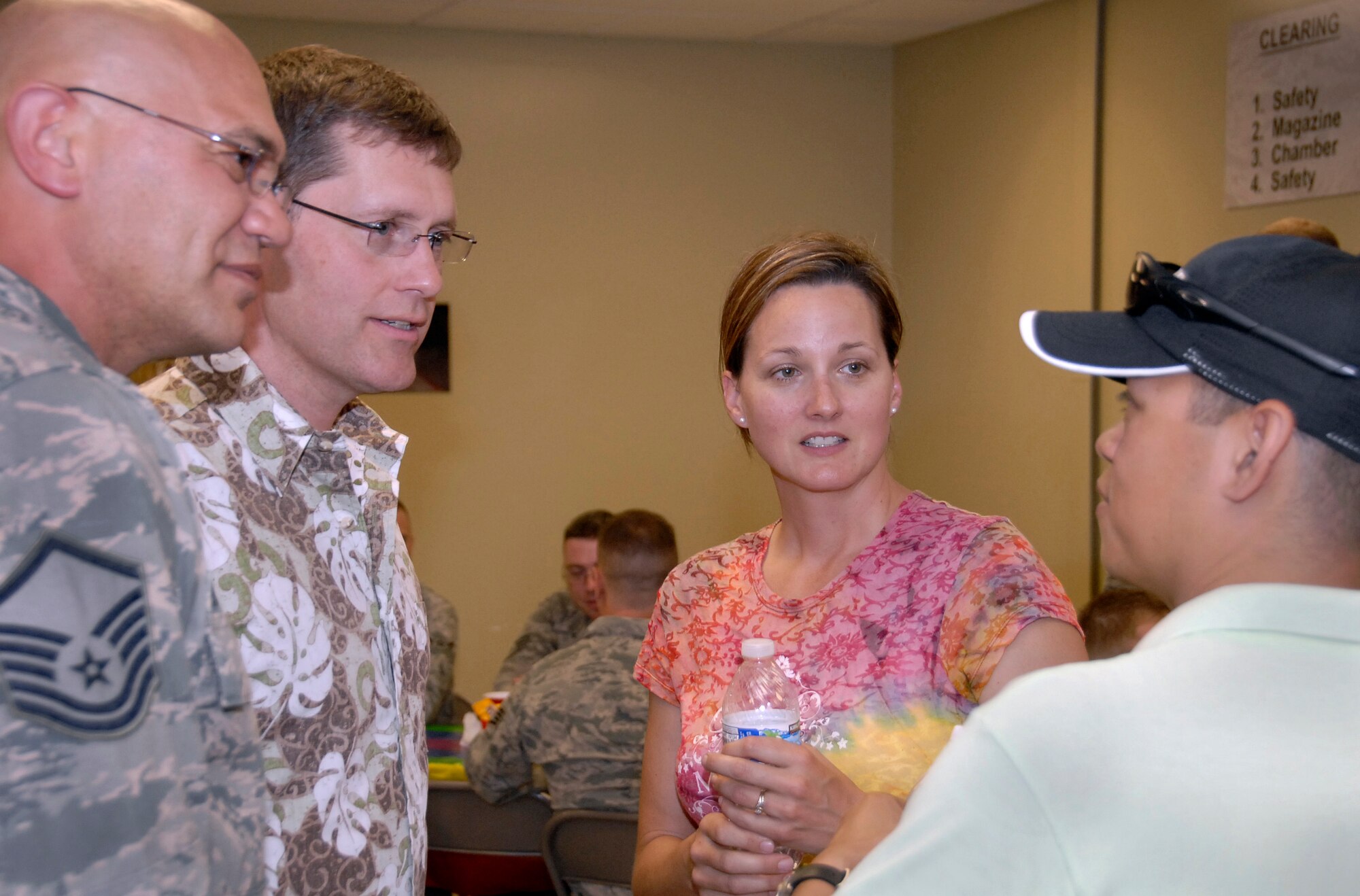Members of the Oregon Air National Guard, friends and family met on base for the lesbian, gay, bisexual, transgender (LGBT) potluck June 8, 2013. This event, a first for the Air National Guard, was designed to create a bridge in the military community. (from left to right in photo) Master Sgt. David Brunstad, Darin Brunstad, Maj. Lisa Scott and Staff Sgt. Ijigale Beltran. (Air National Guard photo by Staff Sgt. Brandon Boyd, 142nd Fighter Wing Public Affairs)   