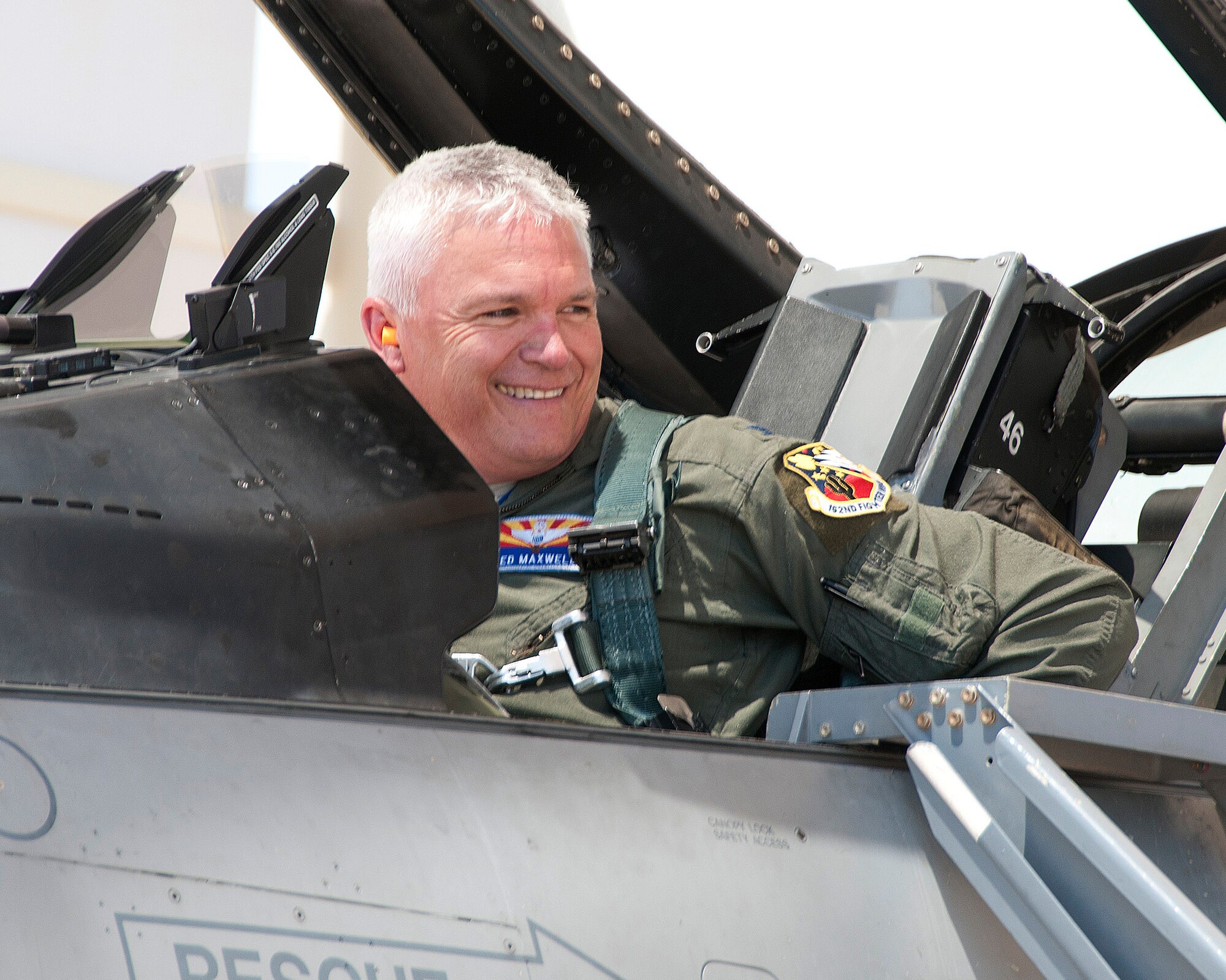 Col Edward Maxwell gives a smile to family and friends as he completes his final "fini" flight at the 162nd Fighter Wing on 31 May.  (U.S. Air National Guard photo by Master Sgt. Amie Neighbors/Released)  