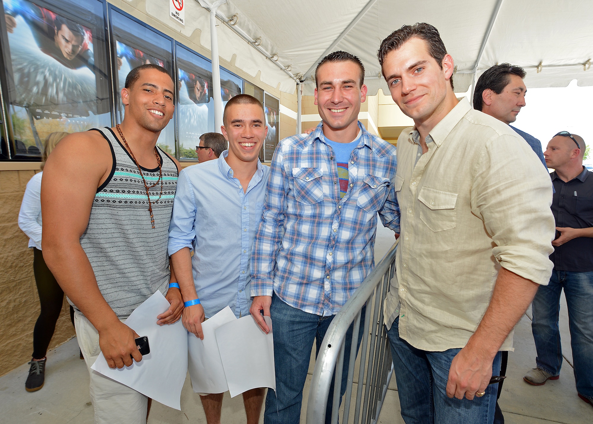 (From left to right) Airman 1st Classes Carlos Colon, Cote Werner and Derek Kramer, from the 412th Operations Support Squadron, pose with Henry Cavill who visited Cinemark 22 June 8 for a special prescreening of Man of Steel for Edwards AFB personnel who helped film the movie early last year. (U.S. Air Force photo by Jet Fabara)
