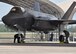 Maintainers from the 33rd Fighter Wing put the chocks on one of two new F-35A Lightning II fighters received at Eglin Air Force Base, Fla., June 5, 2013. Including the Marine Corps variant of the F-35 based here, the training fleet grew to 25 F-35A and F-35B joint strike fighters. The Navy F-35C variant is slated to arrive in the coming weeks. (U.S. Air Force photo/Staff Sgt. Nicholas Egebrecht)