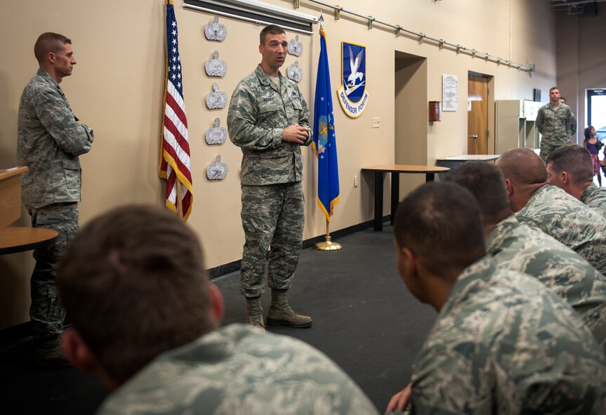 U.S. Air Force Col. Paul Kasuda, 820th Base Defense Group commander, gives a speech before a Bronze Star Medal presentation ceremony at Moody Air Force Base, Ga., June 7, 2013. Four Airmen from the 824th Base Defense Squadron were presented Bronze Star Medals during the ceremony. (U.S. Air Force photo by Senior Airman Jarrod Grammel/Released)
