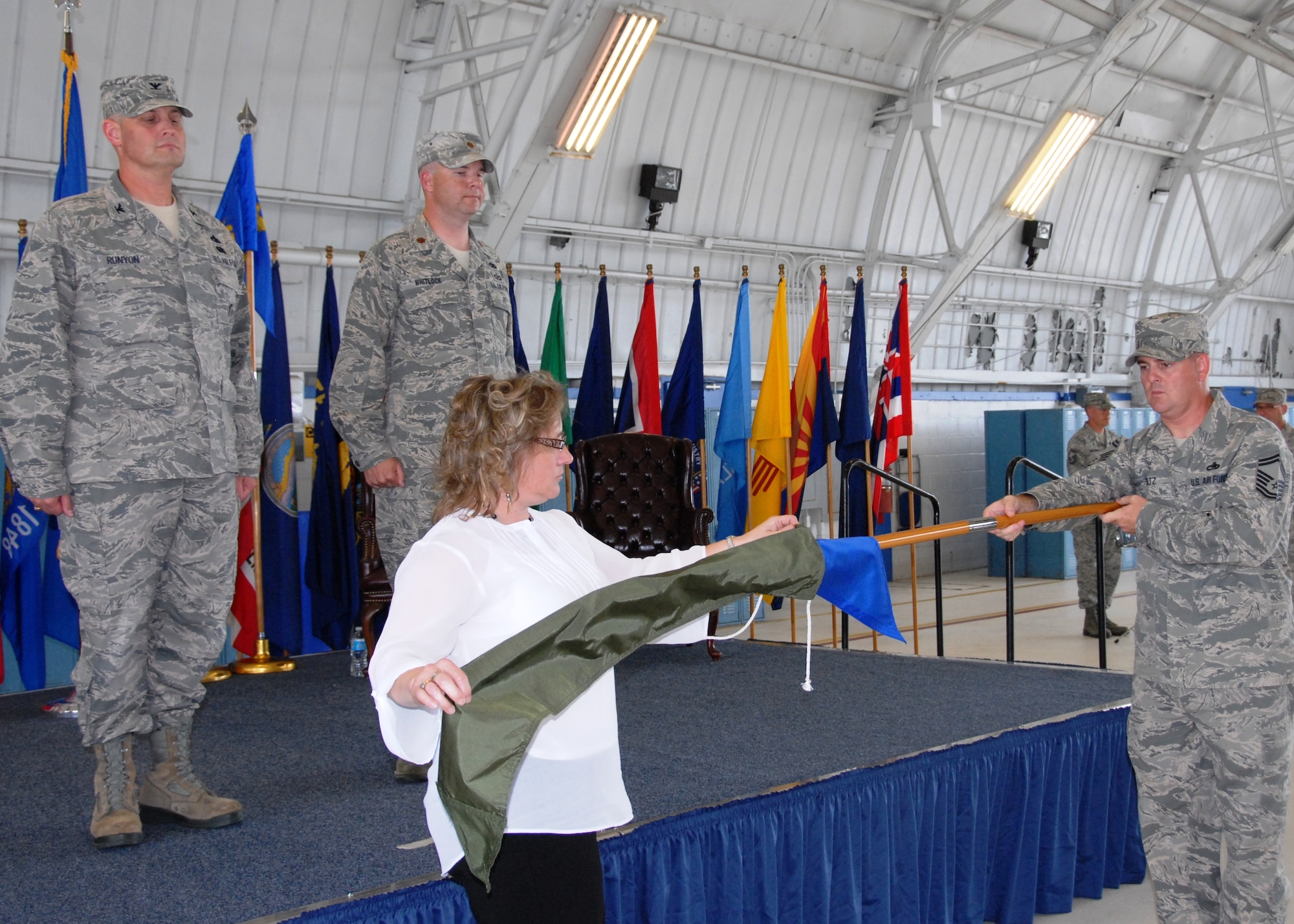 From left, Col. Daniel Runyon, the 96th Maintenance Group commander and Maj. Aaron Whitlock, the former 96th Maintenance Operations Squadron commander watch personnel furl the squadron’s guidon during an inactivation ceremony here June 6. Debra Ray, administrative assistant, sleeved her former unit’s colors with Senior Master Sgt. Jerryl Schultz, the former squadron superintendent. Members who reported to the 96th MOS now reside in maintenance operations, on the 96th MXG staff. (U.S. Air Force photo/Kevin Gaddie)