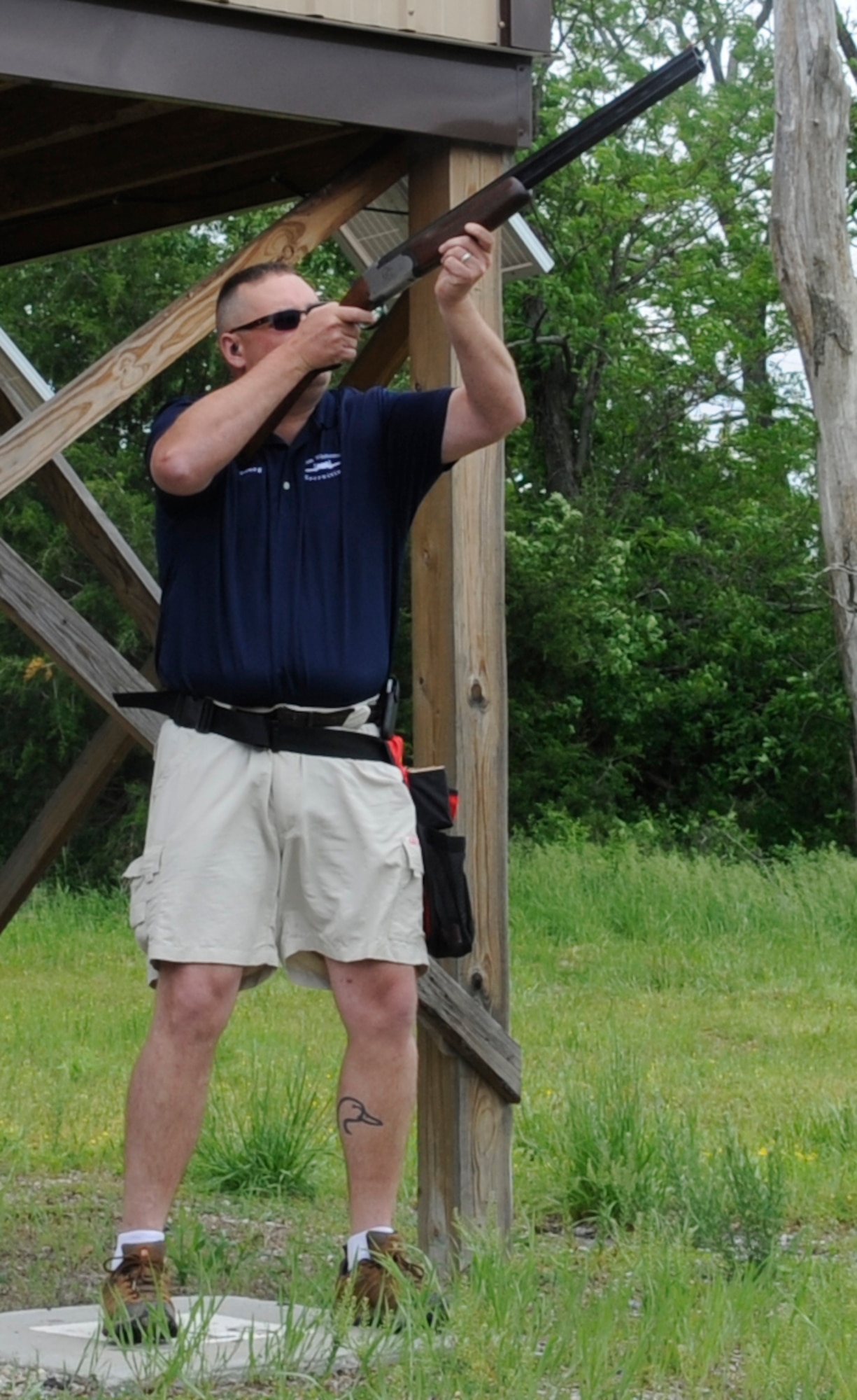 Senior Master Sgt. Frederick Transburg, Air Force Reserve recruiter, prepares to shoot a clay pigeon at the Whiteman Air Force Base Skeet and Trap Range, May 22, 2013. Transburg also takes his wife and 8 year-old daughter to the range. (U.S. Air Force photo by Staff Sgt. Alexandra M. Boutte/Released)