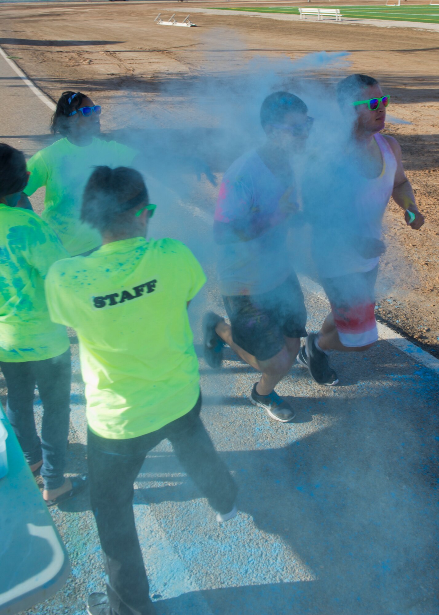 Members of Team Holloman are “blasted” with colored corn starch powder during the Art Blast run at Holloman Air Force Base, N.M., June 8. Over 200 people of all ages participated in this morale-boosting 5k run.  (U.S. Air Force photo by Airman 1st Class Aaron Montoya/Released)