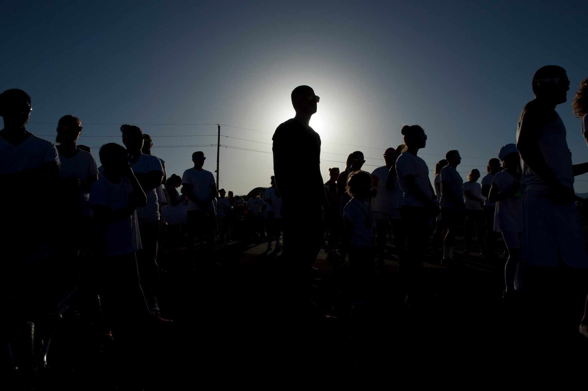 Members of Team Holloman await the start of the Art Blast run at Holloman Air Force Base, N.M., June 8. Over 200 people of all ages participated in this morale-boosting 5k run. (U.S. Air Force photo by Airman 1st Class Aaron Montoya/Released)