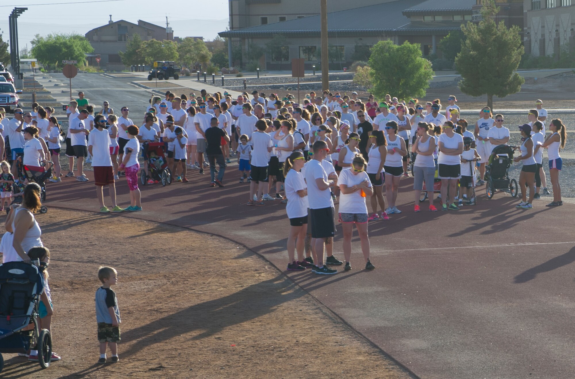 Members of Team Holloman await the start of the Art Blast run at Holloman Air Force Base, N.M., June 8. Over 200 people of all ages participated in this morale-boosting 5k run. (U.S. Air Force photo by Airman 1st Class Aaron Montoya/Released) 