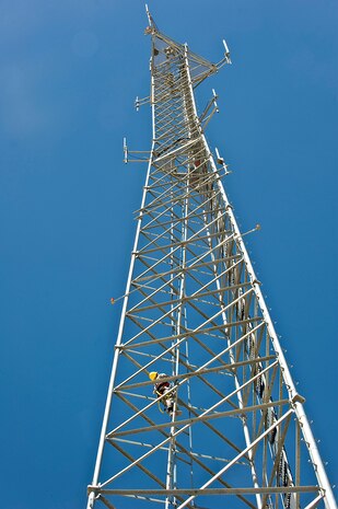 Col. Barry Cornish, 99th Air Base Wing commander, climbs the radio tower during the tower climbing demonstration June 7, 2013, at Nellis Air Force Base, Nev. The radio tower is more than 200 feet tall. (U.S. Air Force photo by Senior Airman Matthew Lancaster)
