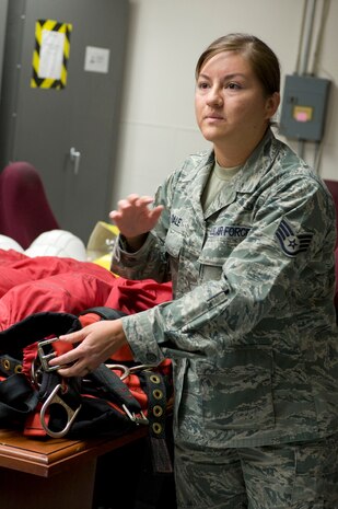 Staff Sgt. Reina Dale, 99th Communications Squadron unit deployment manager, gives a safety briefing and explains how to use the climbing equipment properly before the radio tower climbing demonstration June 7, 2013, at Nellis Air Force Base, Nev. Improper use of the climbing equipment can result in injury. (U.S. Air Force photo by Senior Airman Matthew Lancaster)
