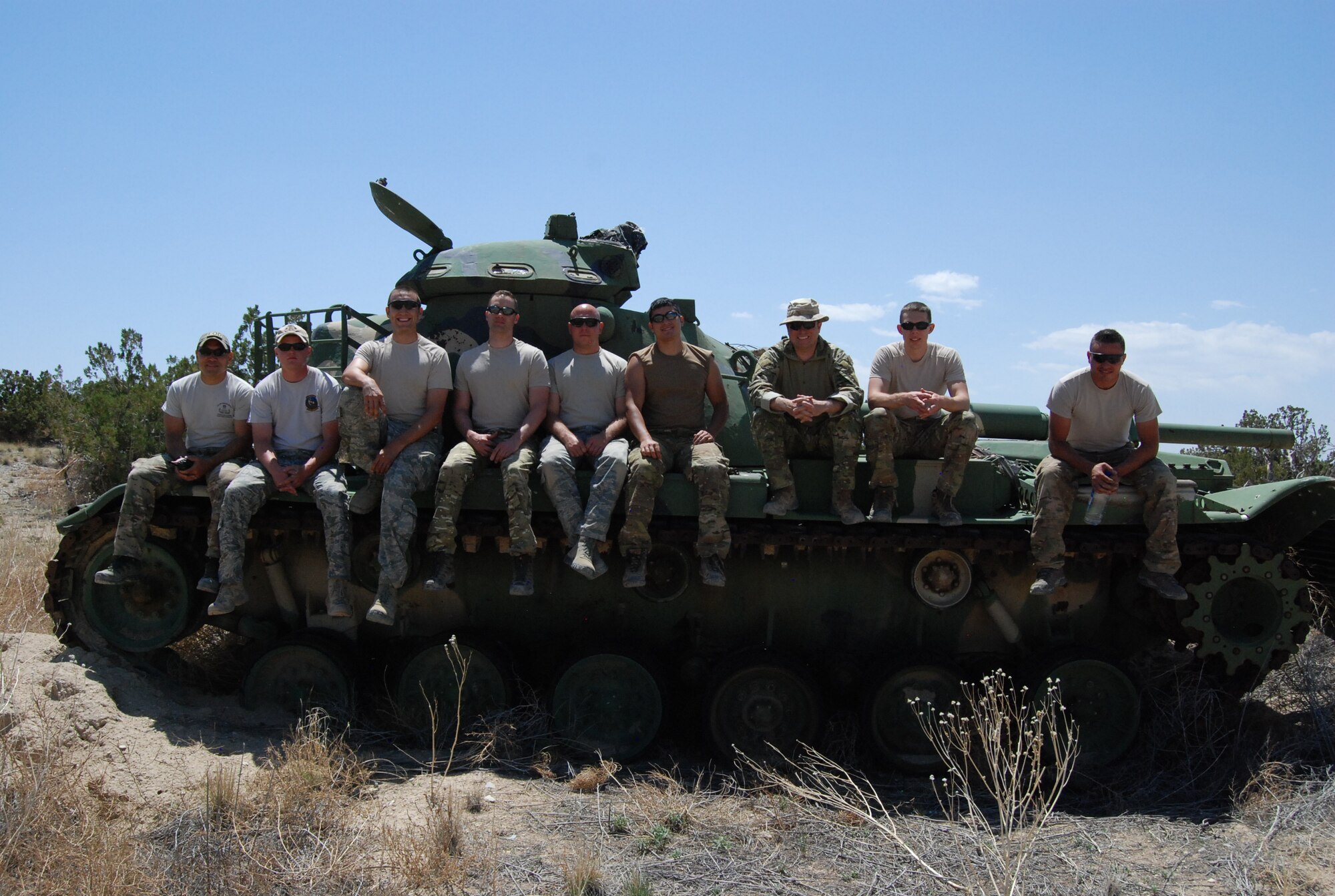 FORT CARSON, Colo. -- Explosive ordnance disposal technicians from the 21st Space Wing, 302nd Airlift Wing and Colorado Air National Guard take a short break from training to bond and cool off. Joint training exercises like this June 4 at Fort Carson help maintain the brotherhood within the EOD community and allows for the sharing of techniques and experiences. (U.S. Air Force photo/Michael Golembesky)