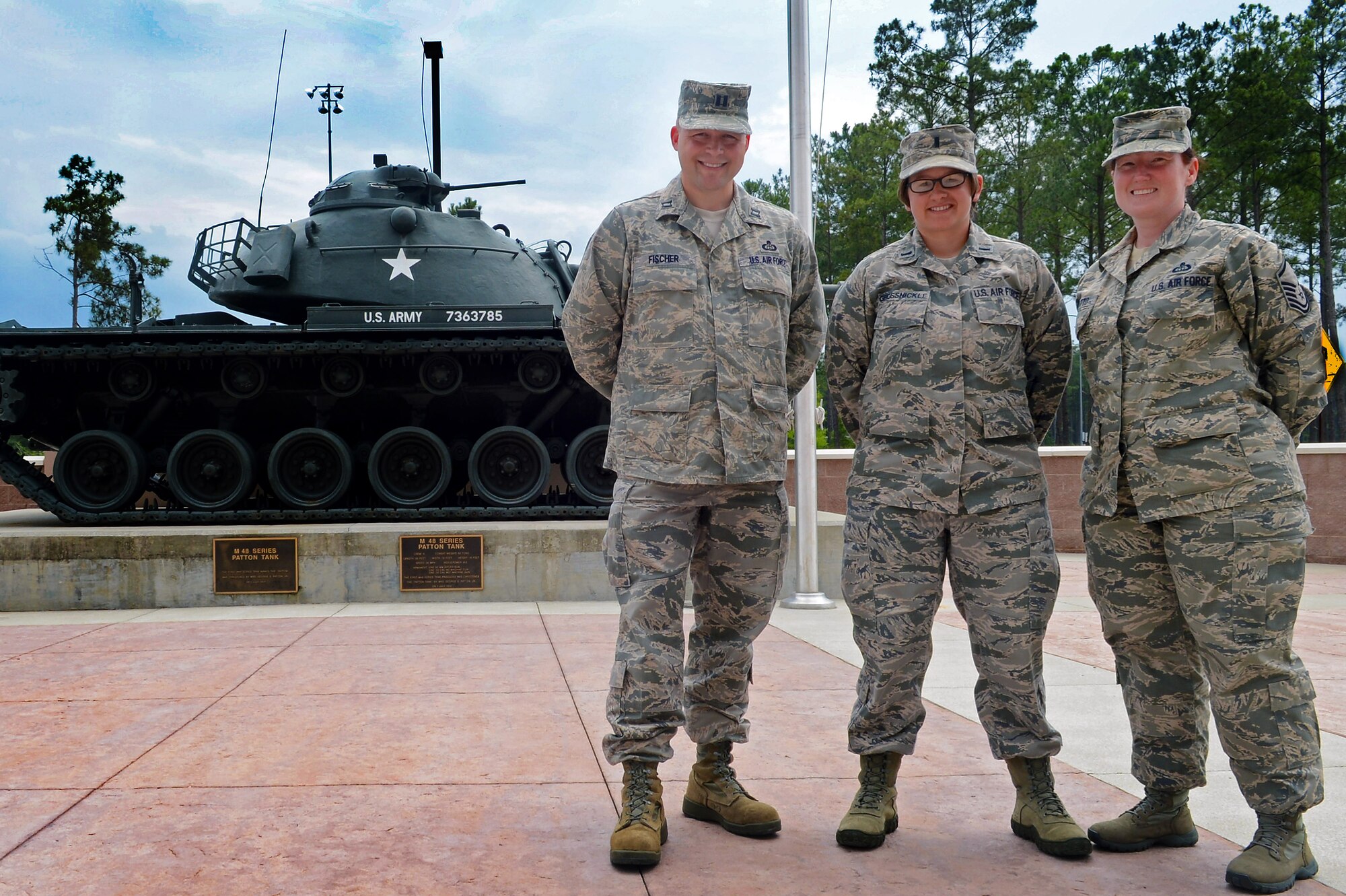 U.S. Air Force Capt. David Fischer, 1st Lt. Julie Grossnickle and Master Sgt. Julie Moretto, all 18th Weather Squadron, staff weather officers, pose for a photo at Shaw Air Force Base, S.C., June 4, 2013.  The SWO’s have monitored environmental events such as super-storm Sandy along the east coast of the U.S., earthquakes in Iran, flooding and avalanches in Pakistan and weather conditions in Afghanistan. (U.S. Air Force photo by Nicole Sikorski/Released)  