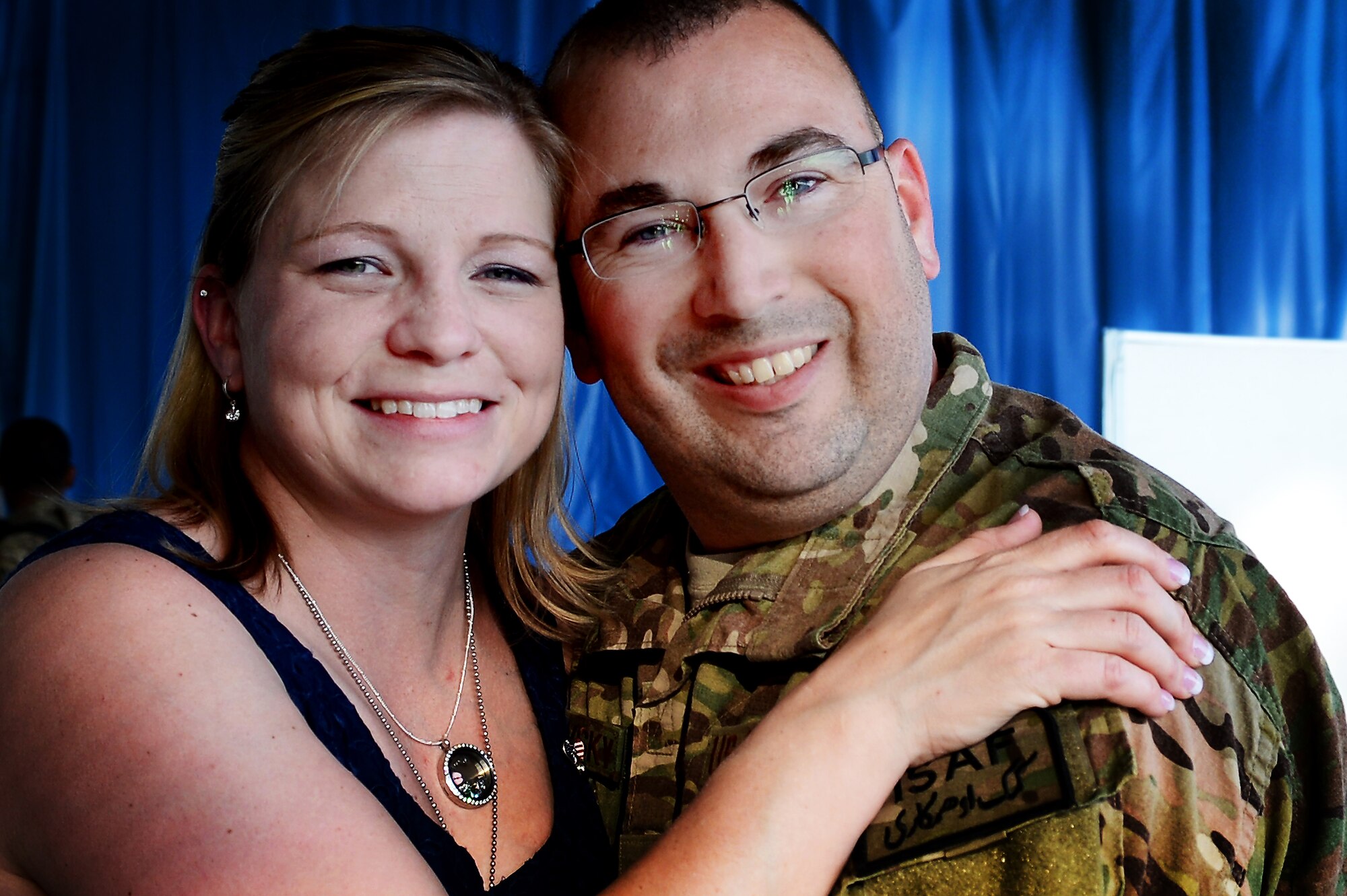 U.S. Air Force Tech. Sgt. Kevin Grabowsky, 20th Equipment Maintenance Squadron production supervisor, and his wife Edith Grabowsky hug after her husband’s return home from a deployment, April 25, 2013, Shaw Air Force Base, S.C. Grabowsky was deployed to Kandahar Airfield, Afghanistan, for six months. While deployed he found out his wife was pregnant with their first child. (U.S. Air Force photo by Airman 1st Class Nicole Sikorski/Released)   