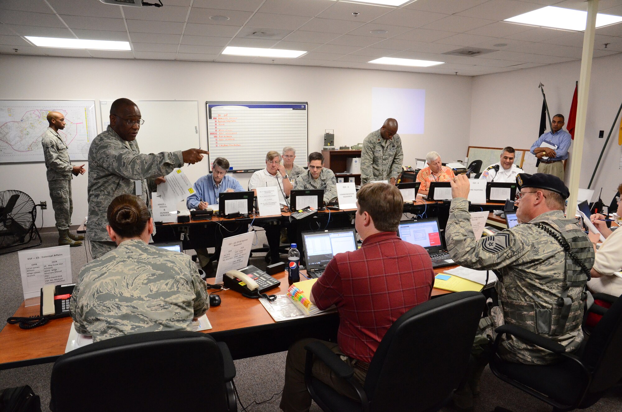 Col. Marshall Irvin, commander, 94th Mission Support Group, elicits information from his wing wide representatives in the Emergency Operations Center during a Major Accident Response Exercise at Dobbins Air Reserve Base, Ga., May 10. The exercise scenario tested the abilities of first responders and key wing leaders and managers to effectively deal with an evolving emergency situation during their 2013 Air Force Reserve Command, Consolidated Unit Inspection. (U.S. Air Force photo/Brad Fallin)