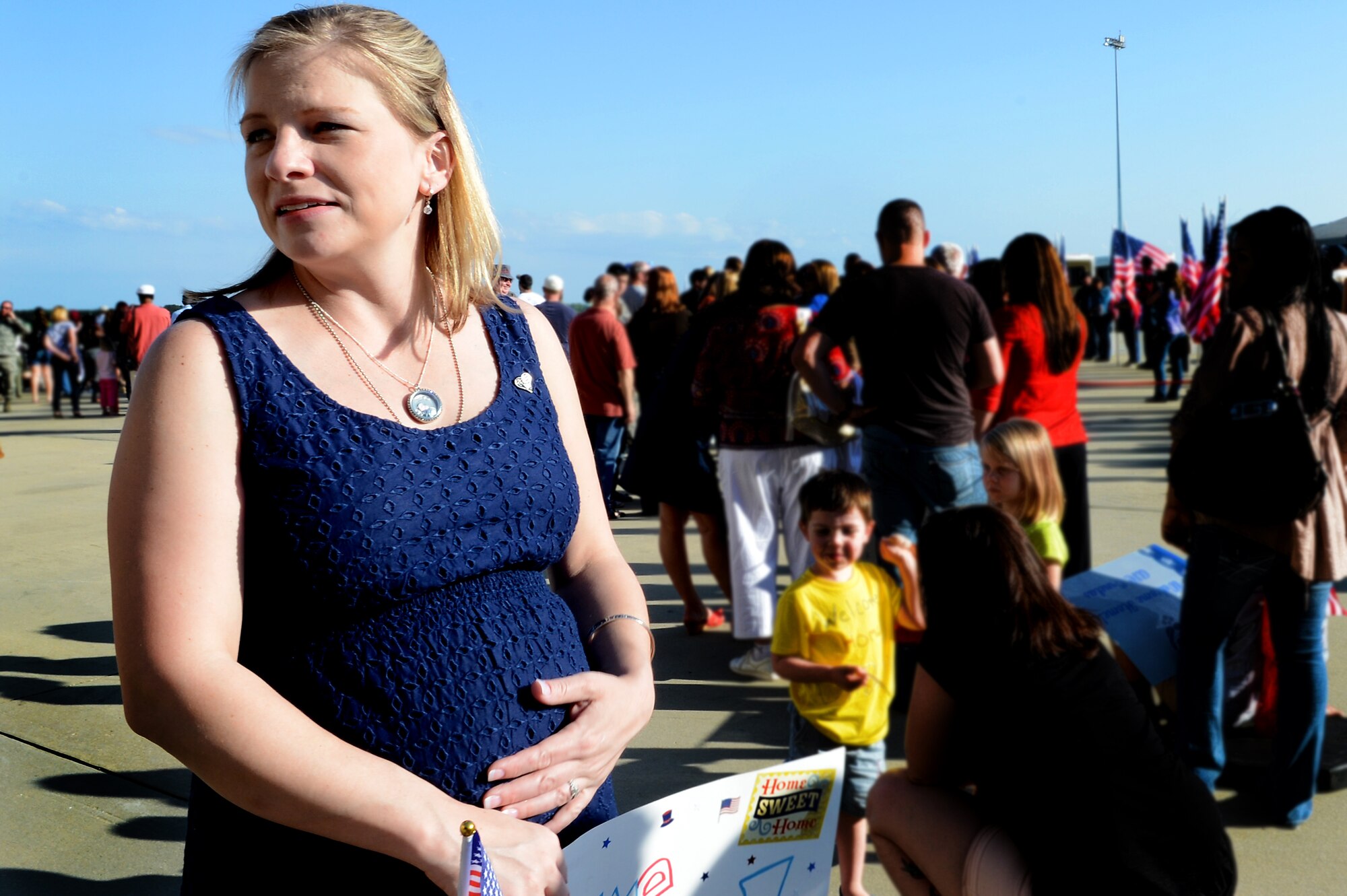 Edith Grabowsky, wife of Tech. Sgt. Kevin Grabowsky, 20th Equipment Maintenance Squadron production supervisor, looks across the Shaw flight line as she waits to welcome home her husband from deployment, April 25, 2013, Shaw Air Force Base, S.C. Grabowsky was deployed to Kandahar Airfield, Afghanistan, for six months. While deployed he found out his wife was pregnant with their first child. (U.S. Air Force photo by Airman 1st Class Nicole Sikorski/Released)