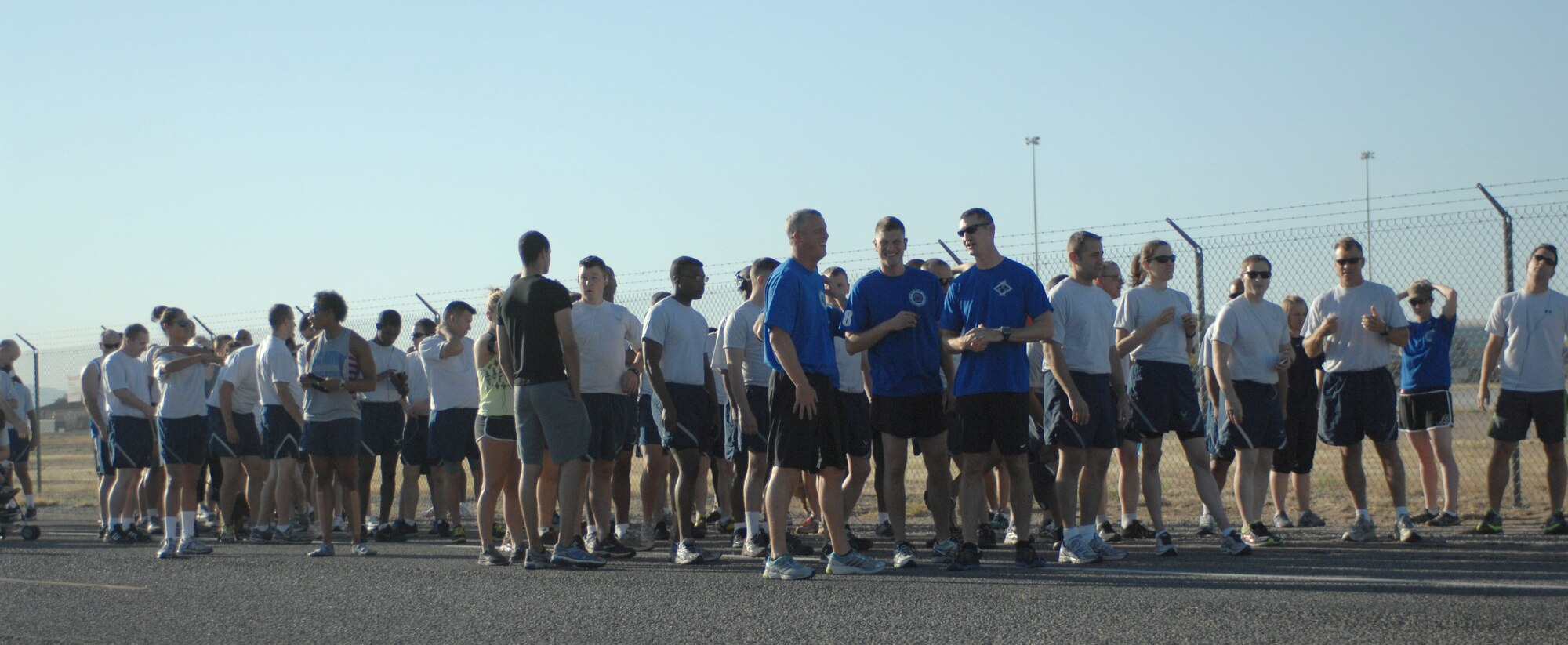 Desert Lightning Team members prepare to start the Family Just for Fun 5K Run at Davis-Monthan Air Force Base, Ariz., June 7, 2013. The run was held by Benko Fitness and sports Center and invited DLT members to bring family and pets. (U.S. Air Force photo by Betty R. Chevalier/Released)