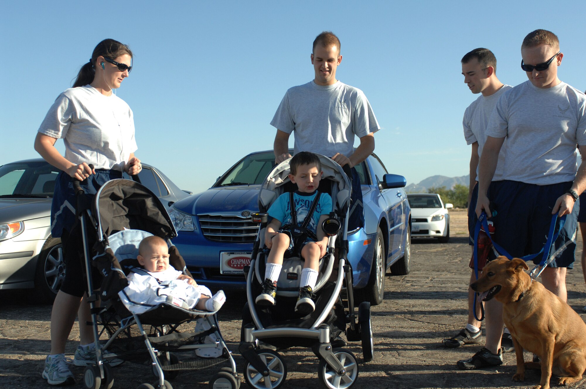 U.S. Air Force Airmen bring their pets and children to the Family Just for Fun 5K Run at Davis-Monthan Air Force Base, Ariz., June 7, 2013. The Benko Fitness and Sports Center has been hosting monthly 5Ks since the gym opened in July 2002. (U.S. Air Force photo by Betty R. Chevalier/Released)