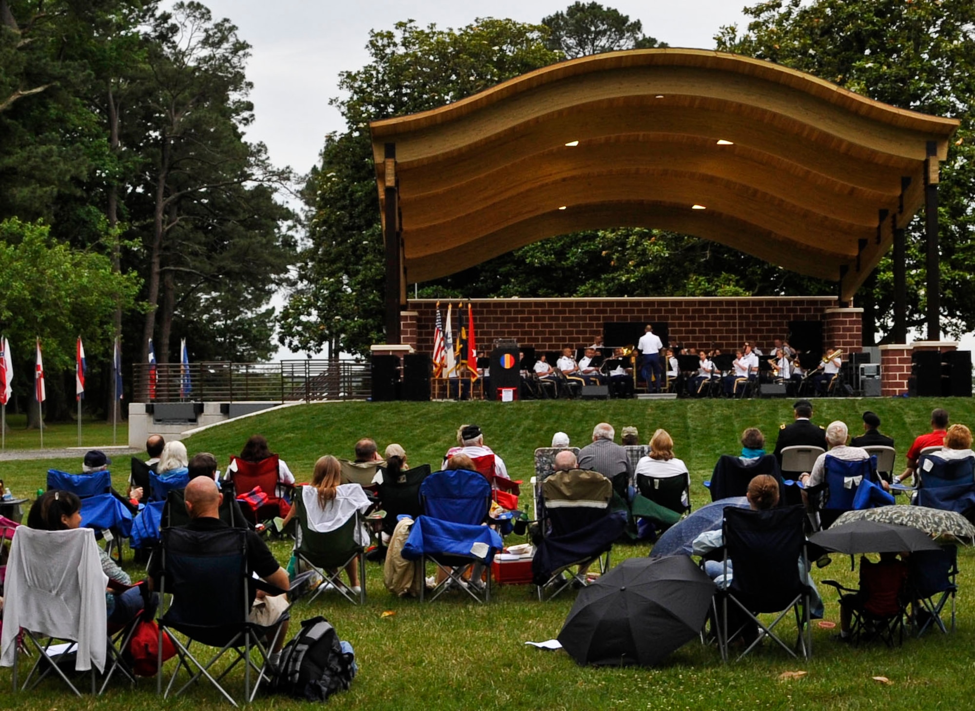 Approximately 200 attendees listens to the U.S. Army Training and Doctrine Command Band during their “Music Under the Stars” kickoff event, June 6, 2013, at Fort Eustis, Va. The music series which is now in its 81st year is scheduled to hold concerts every Thursday evening at 7 p.m. through the month of August. (U.S. Air Force photo by Staff Sgt. Wesley Farnsworth / Released)