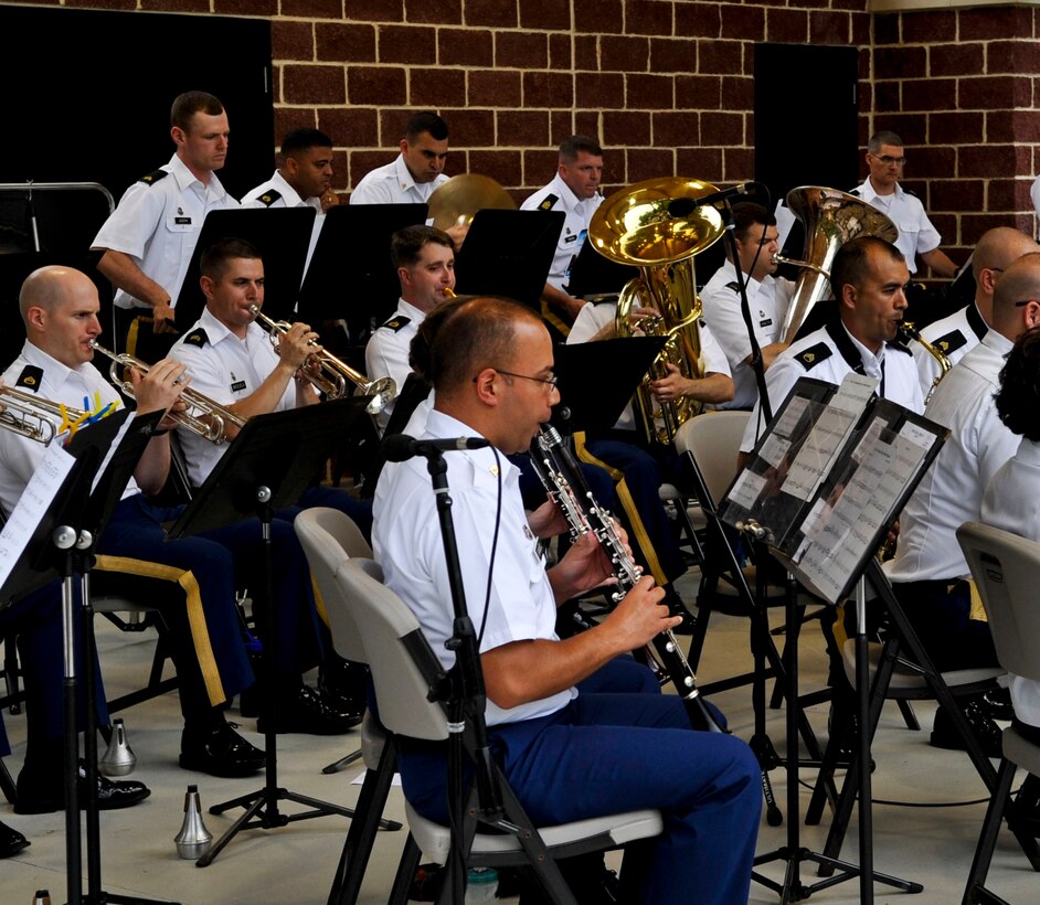 Members of the U.S. Army Training and Doctrine Command Band warm up for the “Music Under the Stars” kickoff event, June 6, 2013, at Fort Eustis, Va. The band is celebrating their 81st year of hosting the free summer concert series. (U.S. Air Force photo by Staff Sgt. Wesley Farnsworth / Released) 