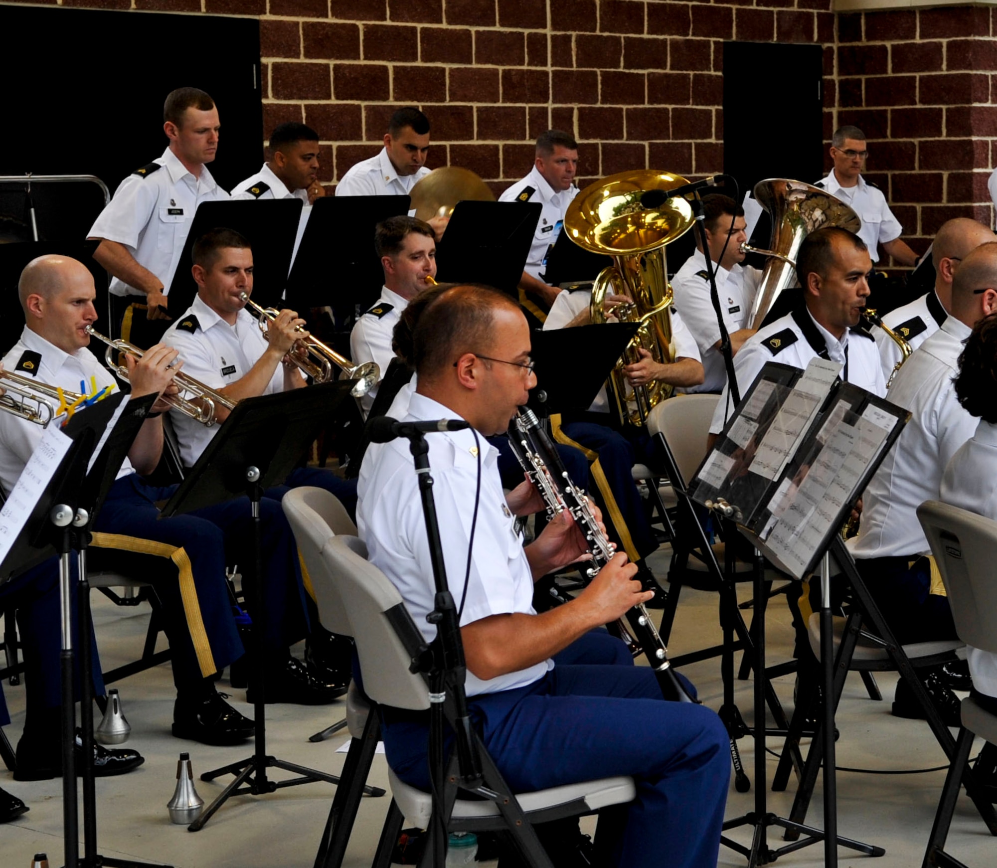 Members of the U.S. Army Training and Doctrine Command Band warm up for the “Music Under the Stars” kickoff event, June 6, 2013, at Fort Eustis, Va. The band is celebrating their 81st year of hosting the free summer concert series. (U.S. Air Force photo by Staff Sgt. Wesley Farnsworth / Released) 